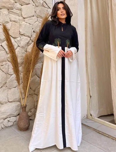 فستان نسائي بنقش من النخل و لونين الأسود و الأبيض